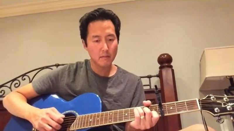 Dr. Anthony Youn playing the guitar