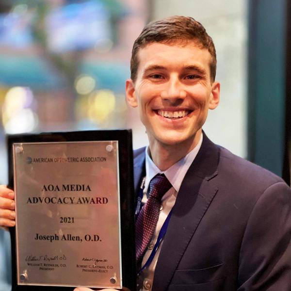 Doctor Eye Health posing with his Media Advocacy Award (2021)