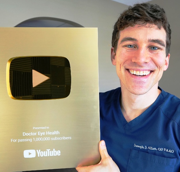 Doctor Eye Health posing with YouTube's Gold Play Button